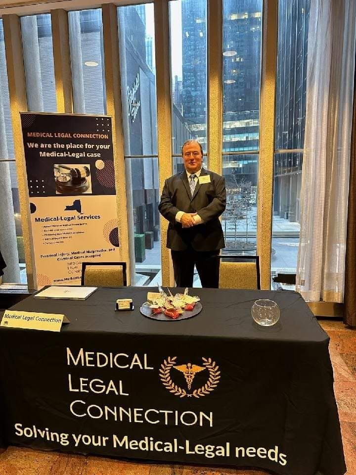 Medical Legal Connection representative at professional conference information booth